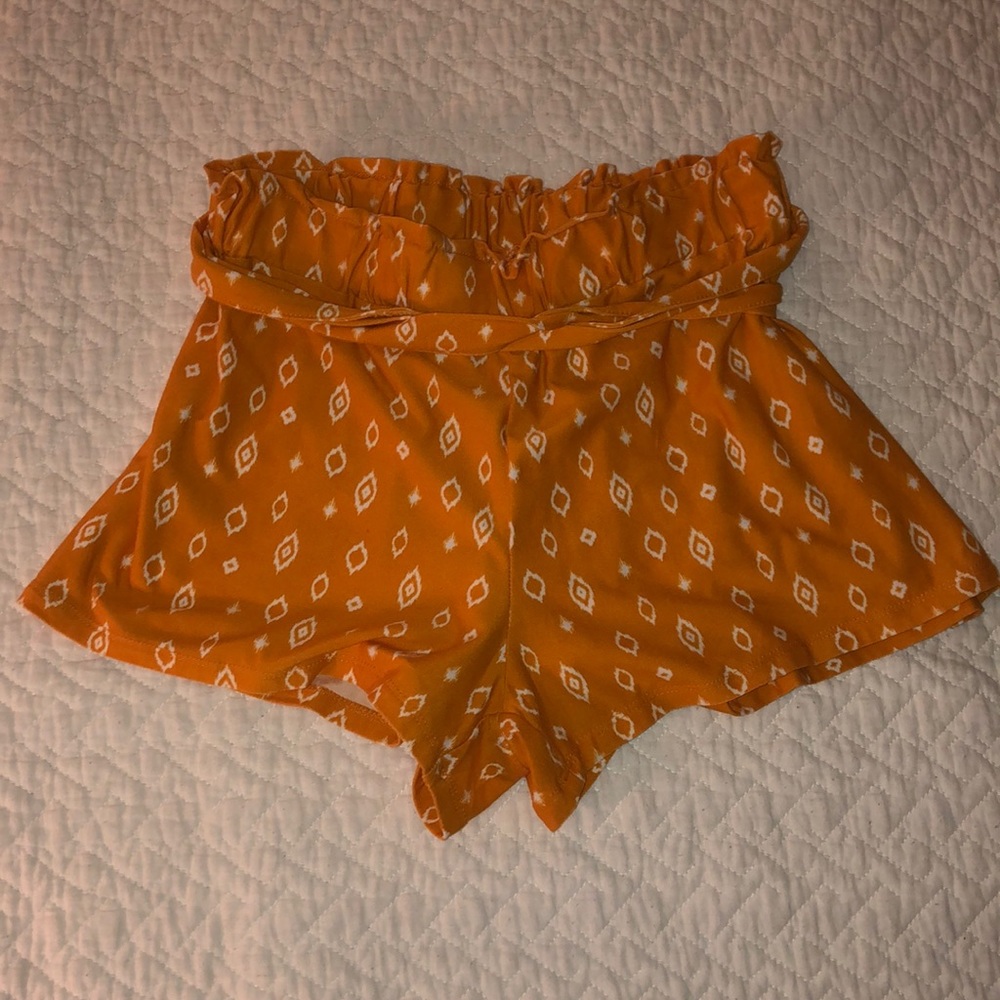 Orange Beachy Shorts with White Accents.